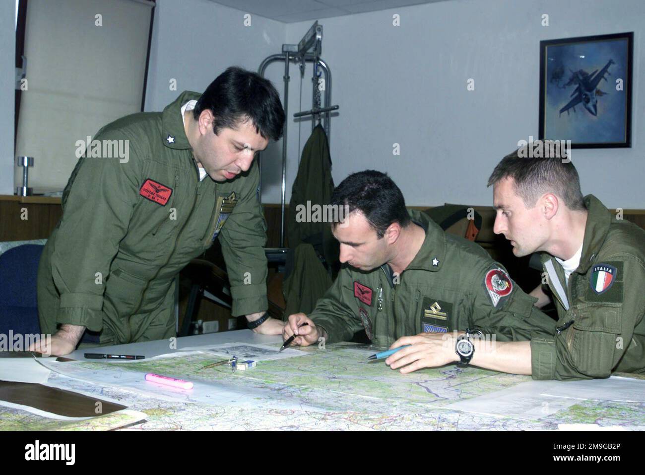 (L-R) Lieutenant Colonel Stefano Tessaro, squadron commander of 14th Fighter Squadron Rivolto AB, Italy oversees Lieutenant Gianluca Tessari and Lieutenant Luca Restelli, both Italian Air Force fighter pilots during exercise CLEAN HUNTER at Spangdahlem AB, Germany. Subject Operation/Series: CLEAN HUNTER Base: Spangdahlem Air Base State: Rheinland-Pfalz Country: Deutschland / Germany (DEU) Scene Major Command Shown: USAFE Stock Photo