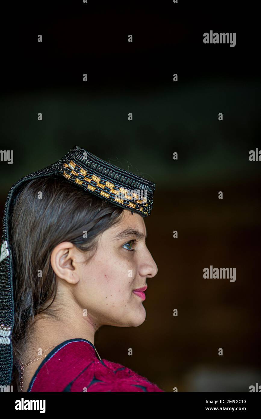 Profile portrait of a Kalash beautiful girl with traditional beaded ...