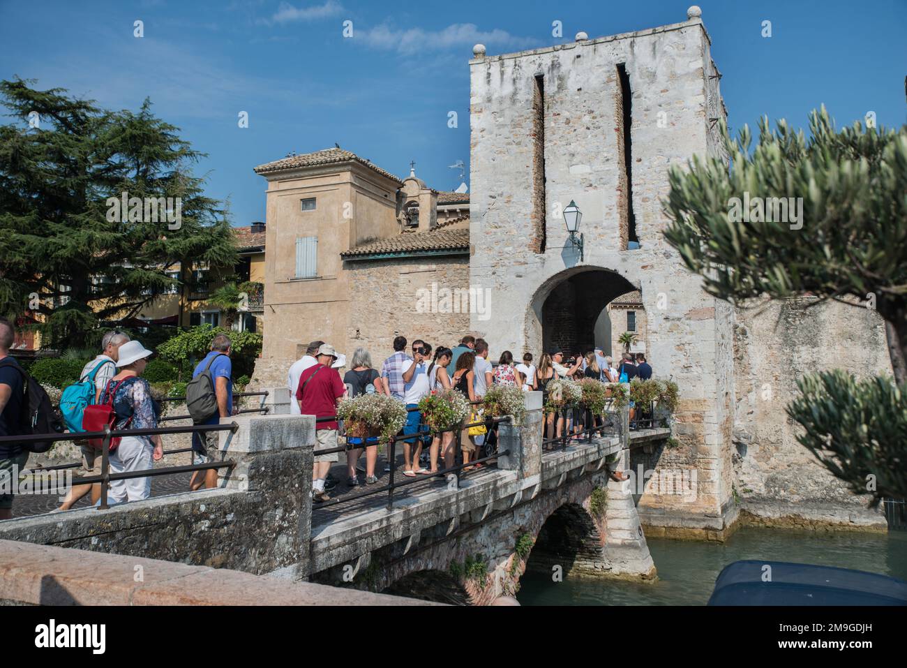 Tourists queueing to get into the castle in Sermione, Lake Garda, Northern Italy Stock Photo