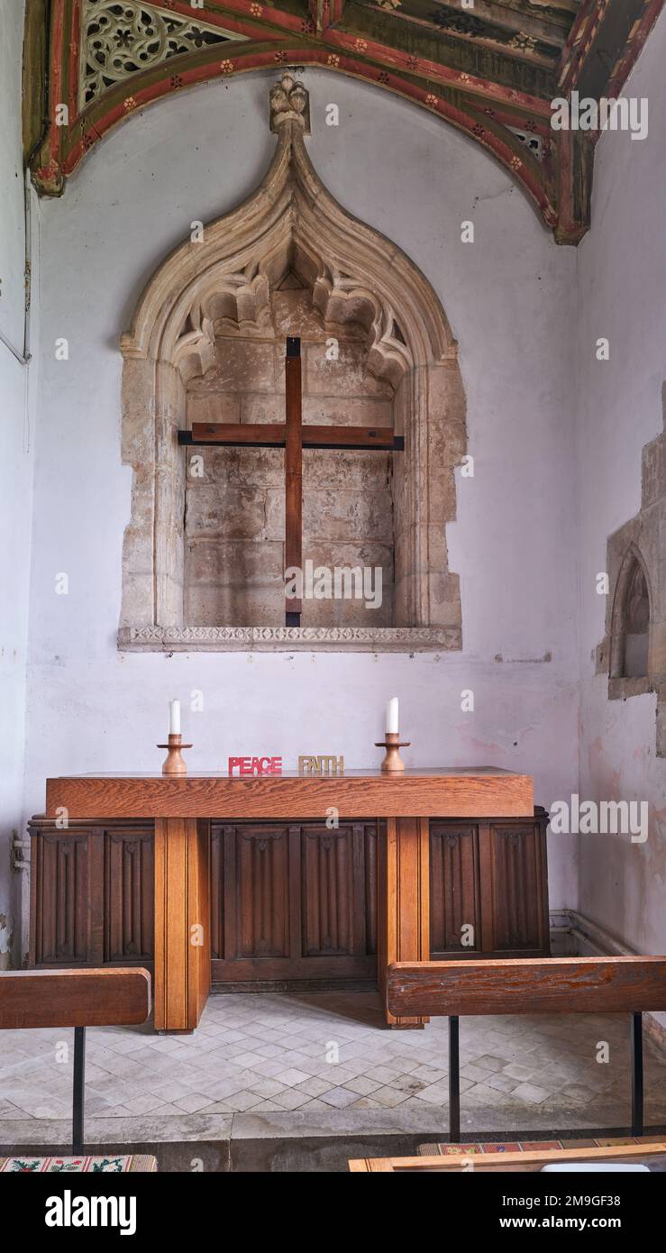 A side chapel with the words faith and peace, at the medieval fourteenth century christian church in the village of Wilbarston, England. Stock Photo