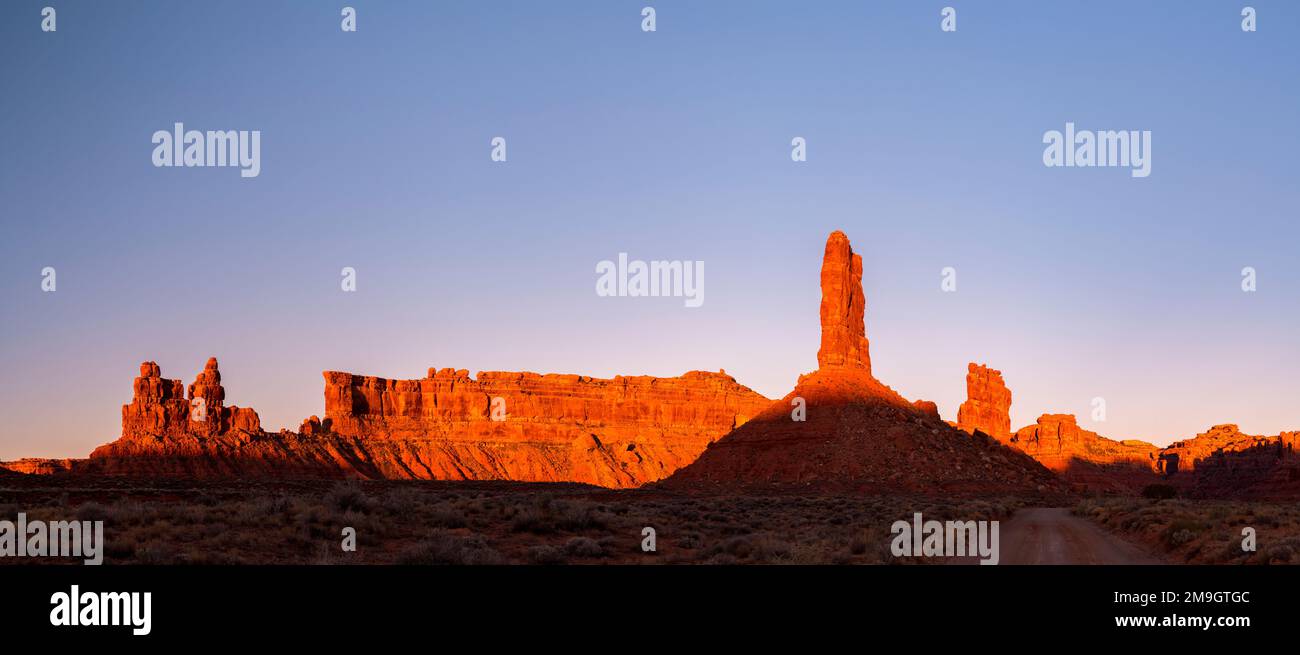 Rock formations in desert at sunset, Valley of the Gods, Colorado Plateau, Great Basin Desert, Utah, USA Stock Photo