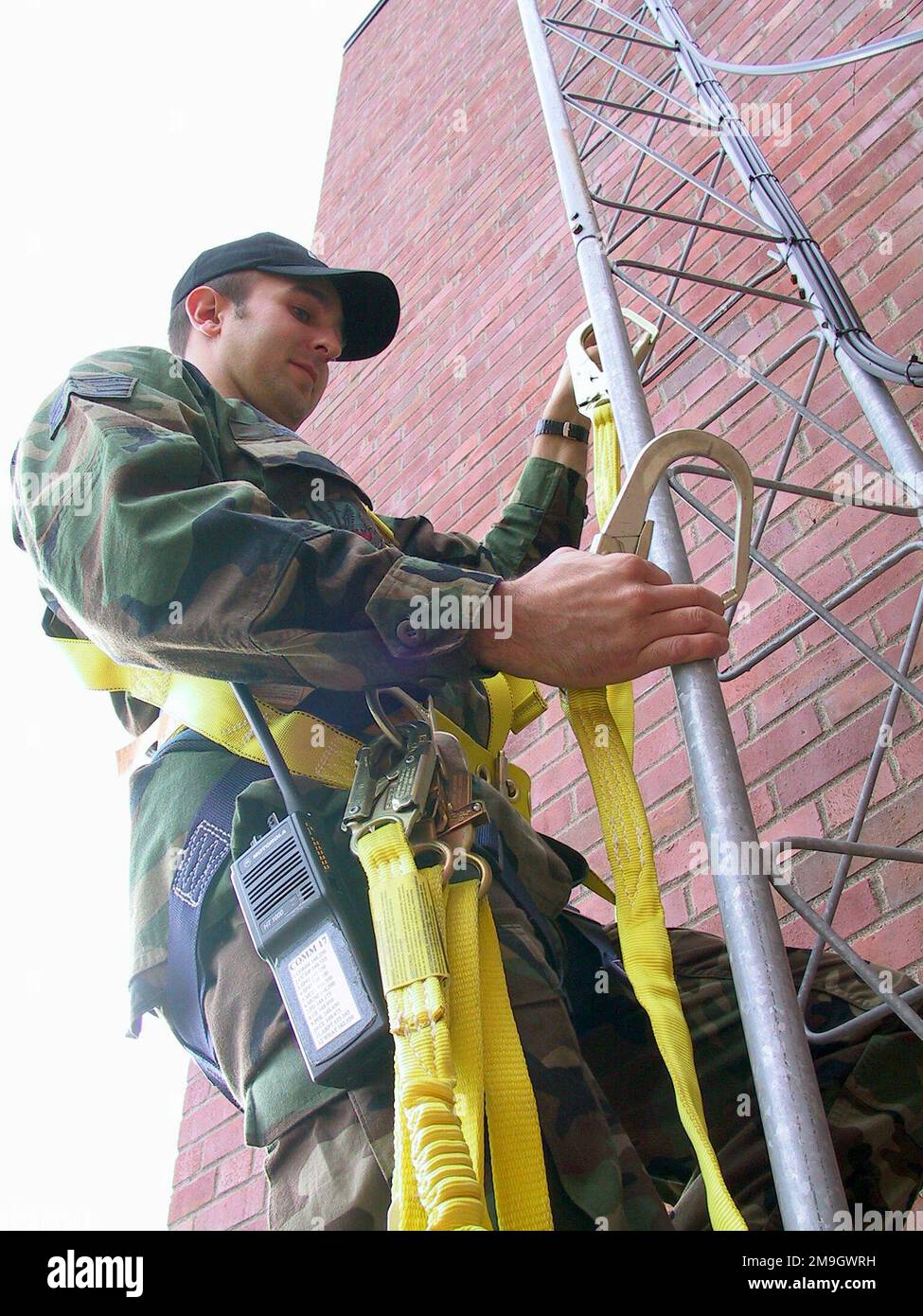 STAFF Sergeant Bryan Druar, USAF, 148th Communications Flight, Duluth Air National Guard, Duluth International Airport, Minnesota, conducts a final check of his personal safety equipment prior to climbing a communications tower at the Wing. It is part of a plan, after their inspection, to replace older structures with an upgrade. Base: Duluth International Airport State: Minnesota (MN) Country: United States Of America (USA) Scene Major Command Shown: ANG Stock Photo