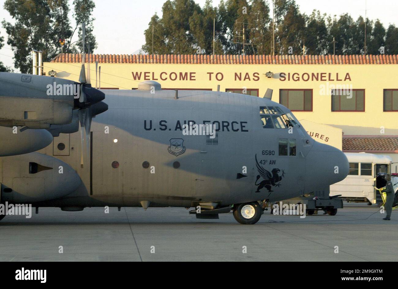 A C-130 Hercules, 43rd Airlift Wing, Pope AFB, North Carolina, arrives at Naval Air Station Sigonella, Sicily. The aircraft carried country singer Clint Black and other entertainers to Sigonella for a free concert during Operation ENDURING FREEDOM. In response to the terrorist attacks on September 11, 2001 at the New York World Trade Center and the Pentagon, President George W. Bush initiated Operation ENDURING FREEDOM in support of the Global War on Terrorism (GWOT), fighting terrorism abroad. Subject Operation/Series: ENDURING FREEDOM Base: Naval Air Station, Sigonella State: Sicily Country: Stock Photo