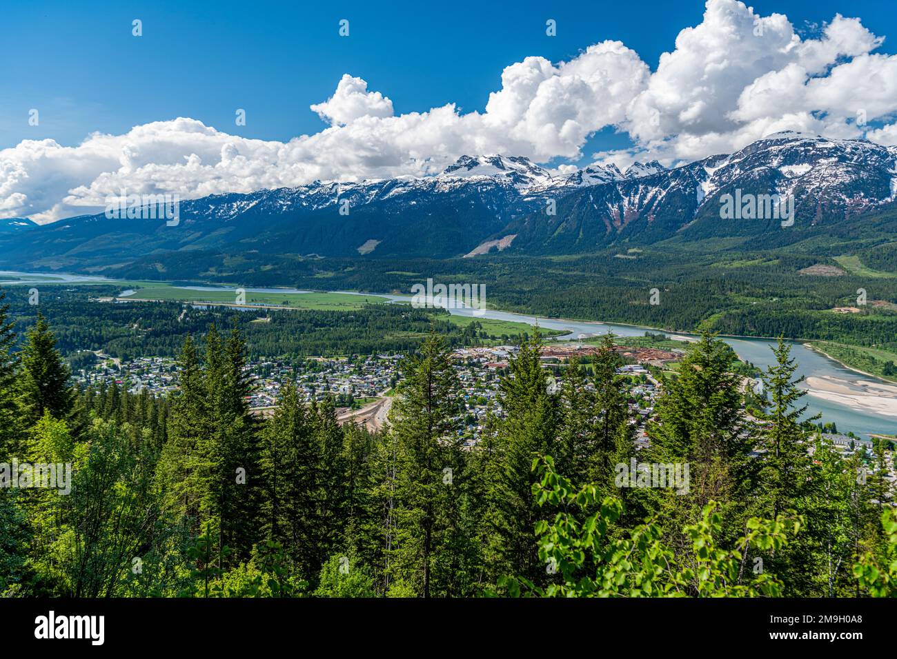 Distant view of city of Revelstoke, Monashee Mountains and Columbia River, British Columbia, Canada Stock Photo