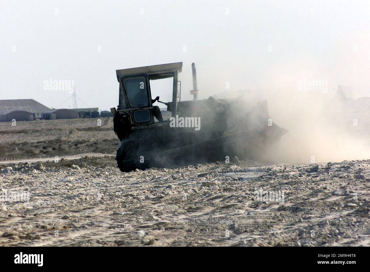 A member of the 823rd Red Horse Civil Engineering Squadron (CES) uses a ...
