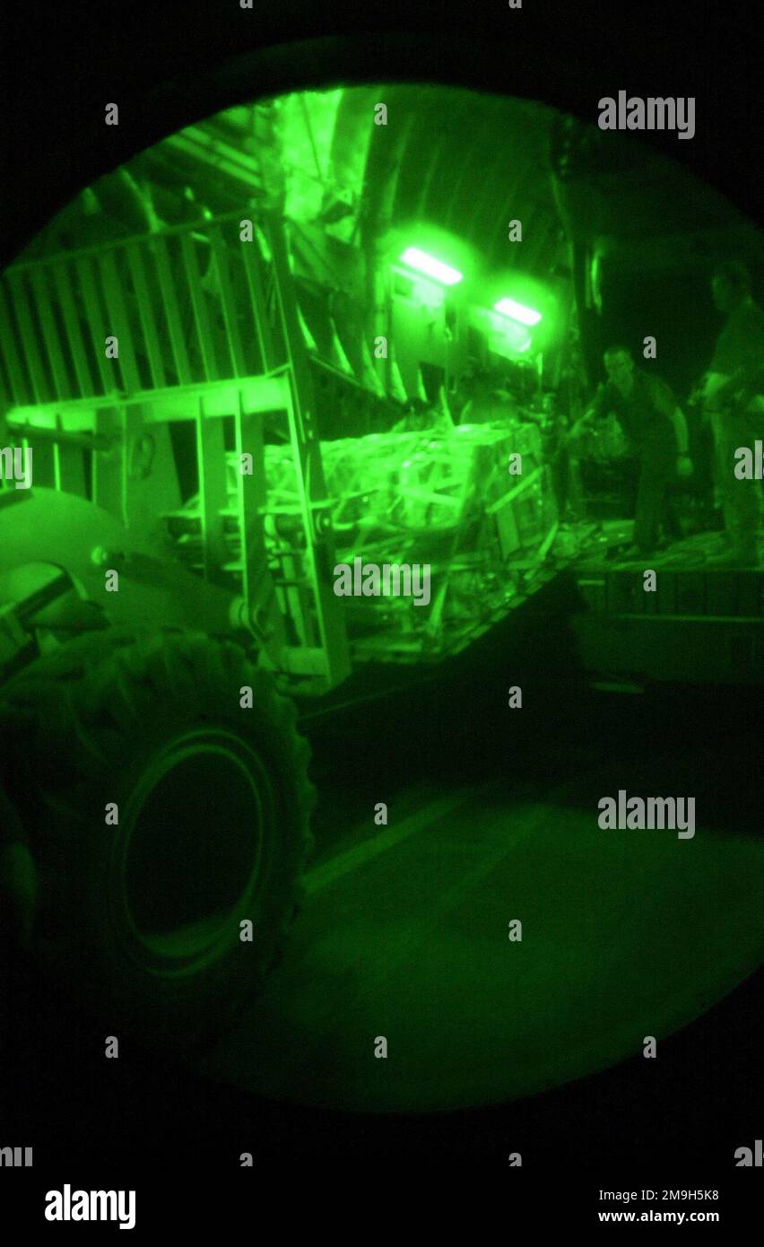 Members of the 615th Tanker Airlift Control Element (TACE), Travis Air Force Base, California, download cargo from a C-17 Globemaster III, in support of Operation ENDURING FREEDOM. Subject Operation/Series: ENDURING FREEDOM Country: Unknown Scene Major Command Shown: AMC Stock Photo