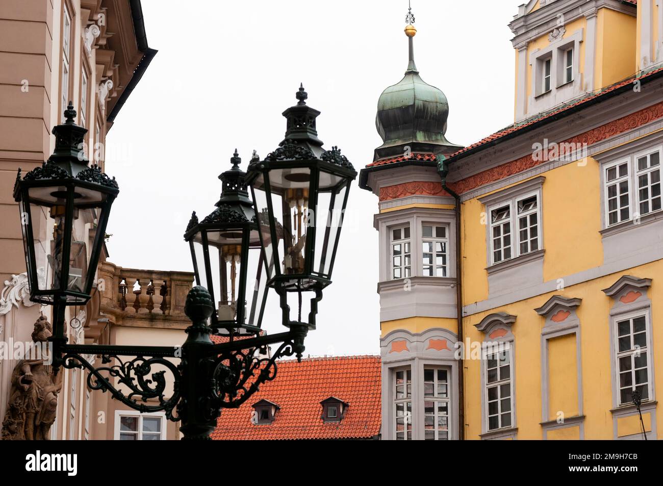 Close up of old fashioned triple light fixture in old town of Prague, Czech Republic Stock Photo