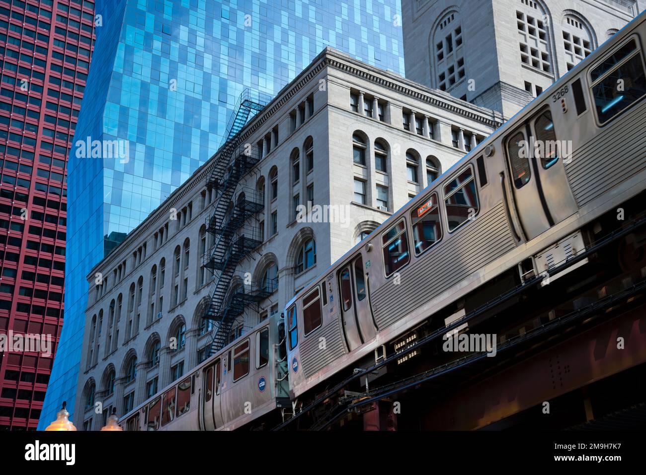Elevated train passing buildings, Loop district, Chicago, Illinois, USA Stock Photo