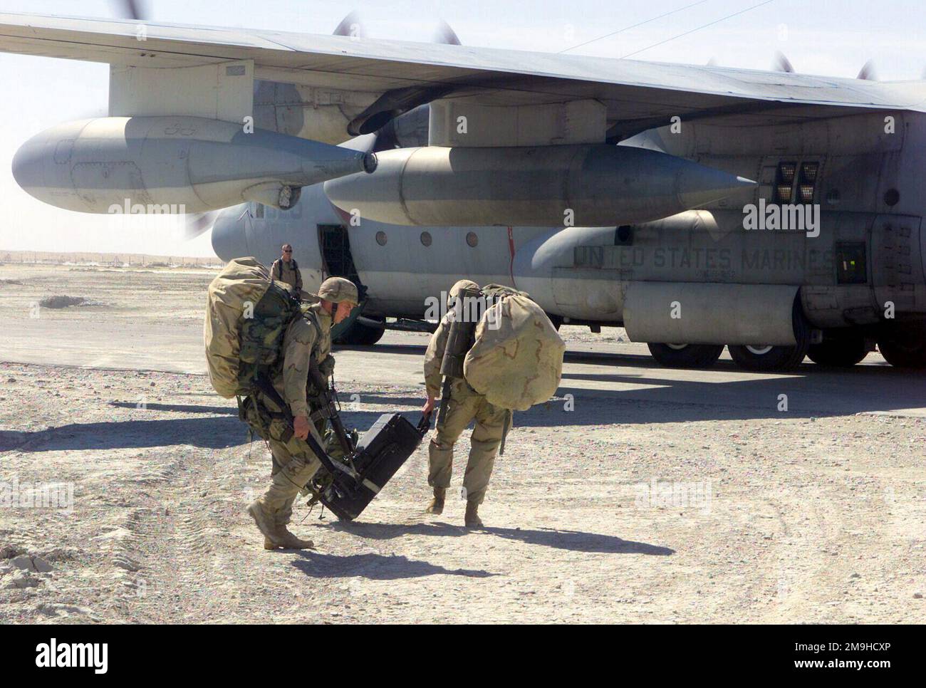 Marines, with backpacks, 5.56 mm Colt M16A2 Assault Rifles, and extra