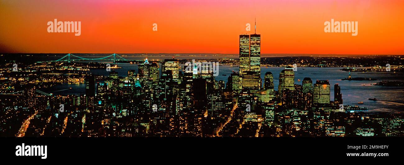 Aerial view of New York City under orange sky at sunset with Twin Towers, USA Stock Photo