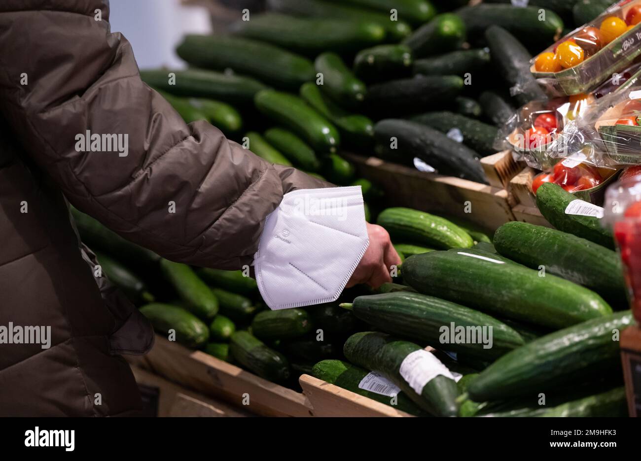 Neubiberg, Germany. 18th Jan, 2023. A woman stands by a display of ...