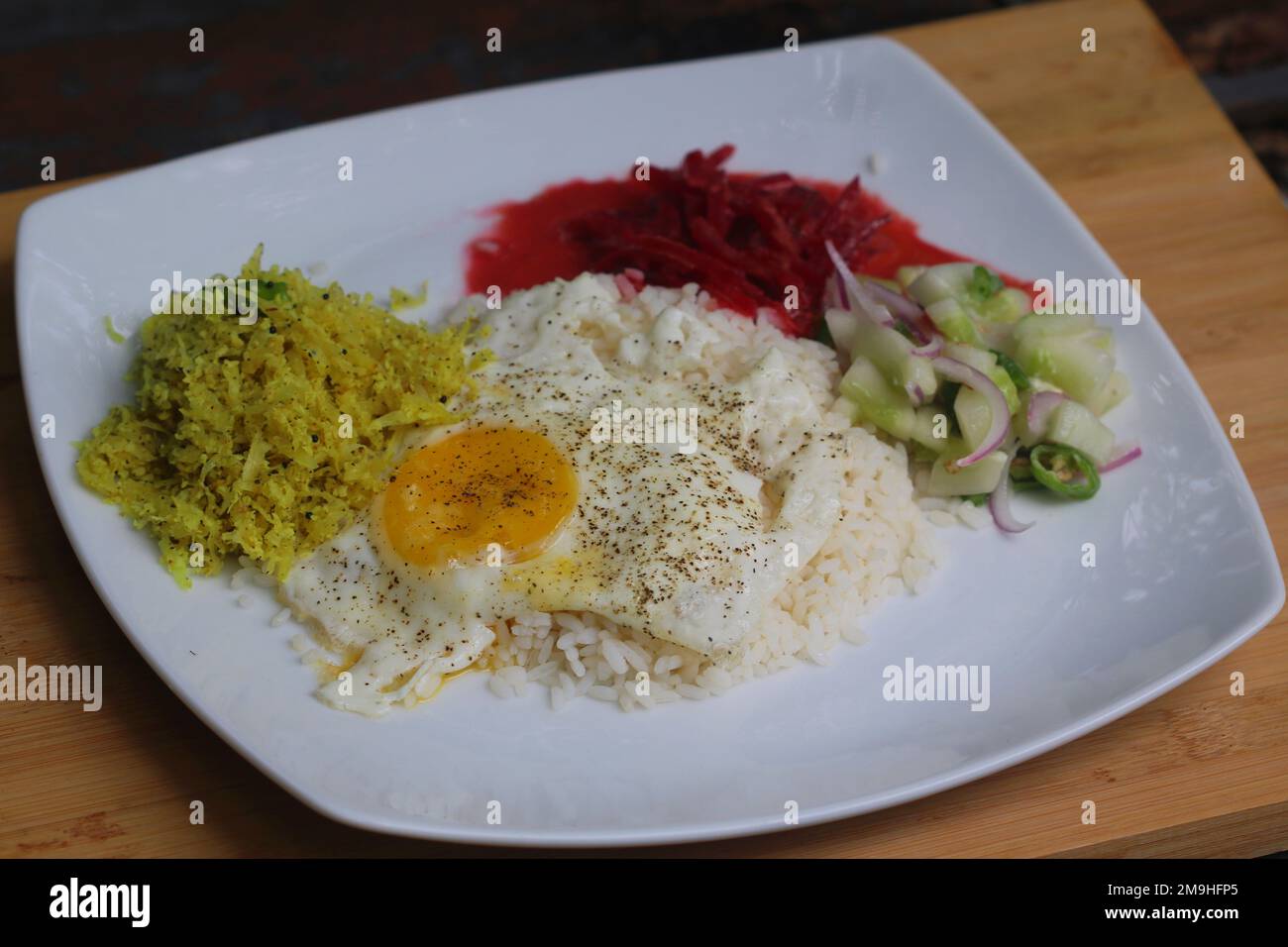 Papaya Rice A closeup of Sri Lankan rice and curry with white rice, fried egg ...