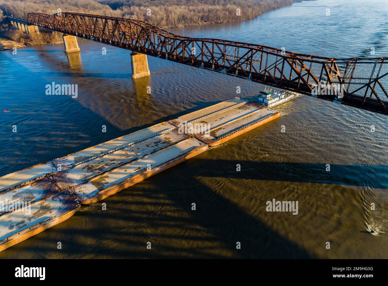 Aerial view of barge on Mississippi River passing under Union, Pacific RR bridge near Thebes, Alexander County, Illinois, USA Stock Photo