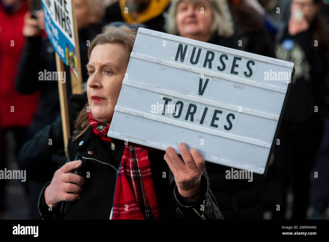 London, UK. 18th Jan, 2023. A protest rally and march is taking place in support of striking healthcare workers asking for improved pay and working conditions. Protesters gathered outside the UCL and marched to Downing Street with messages for the government. Nurses v Tories Stock Photo