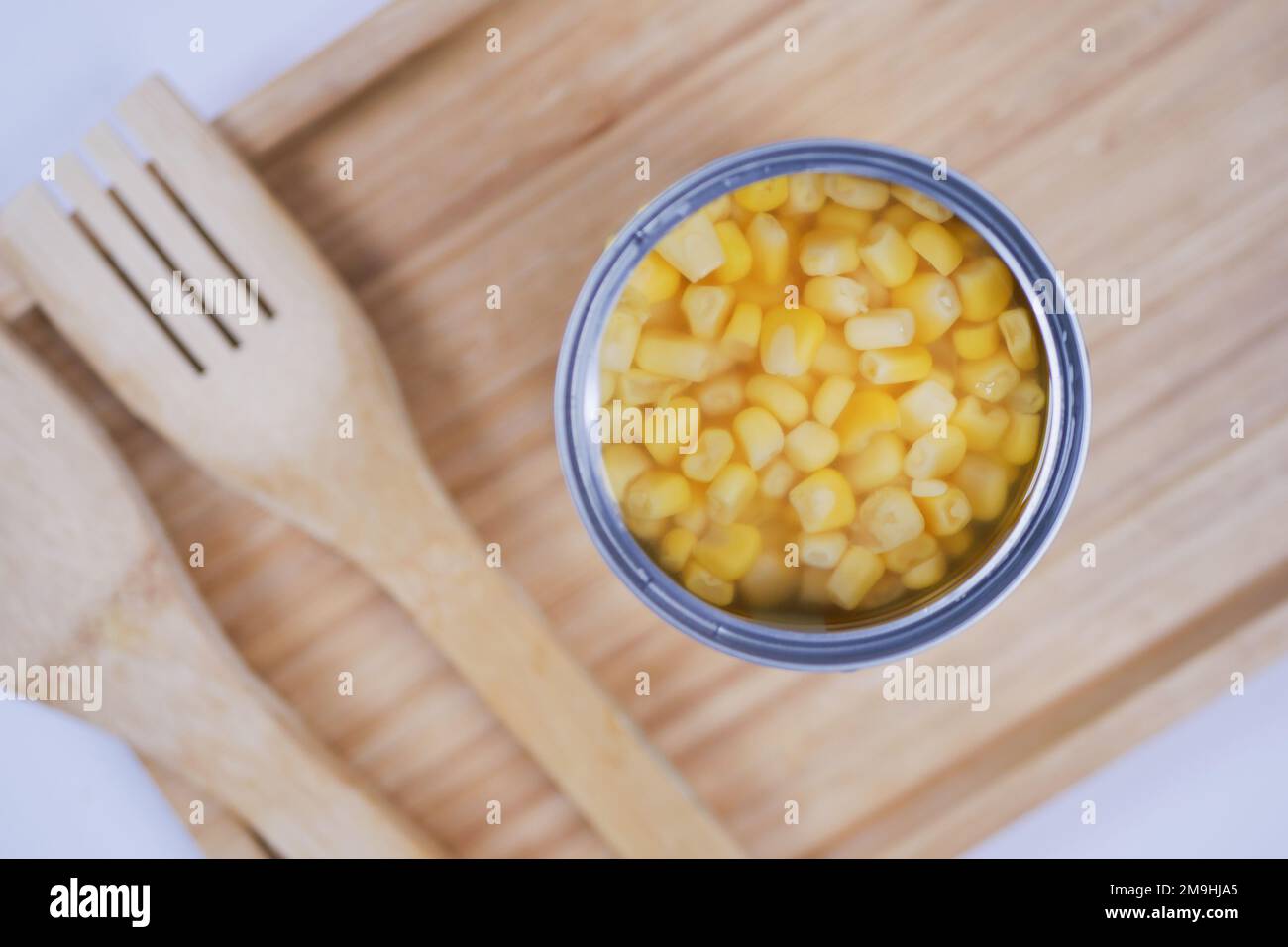 preserved sweet corm in a tin container on table  Stock Photo