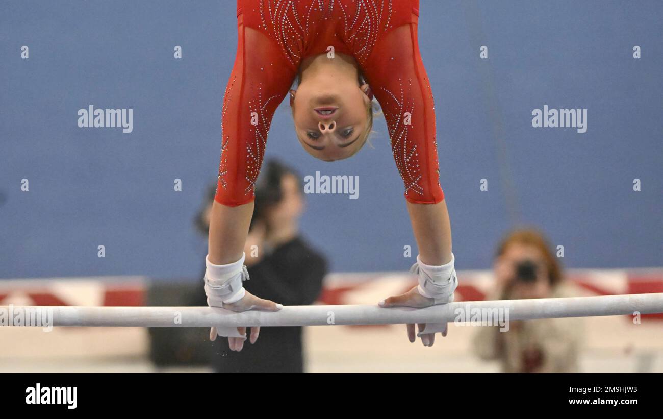 Arkansas gymnast Frankie Price competes on the bars against Alabama