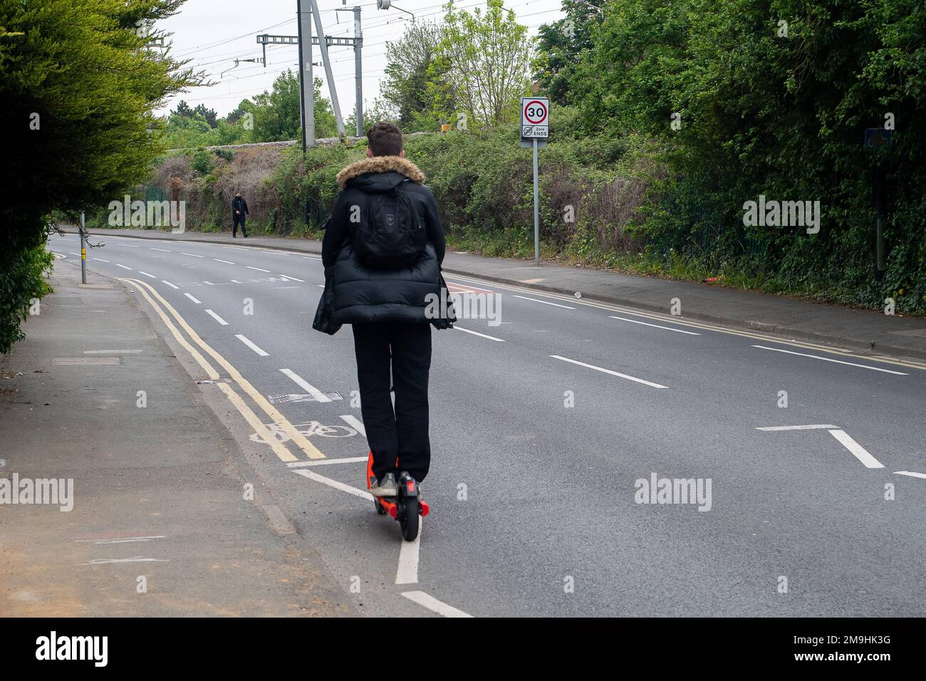 Slough, Berkshire, UK. 4th May, 2022. A young man rides a Neuron e
