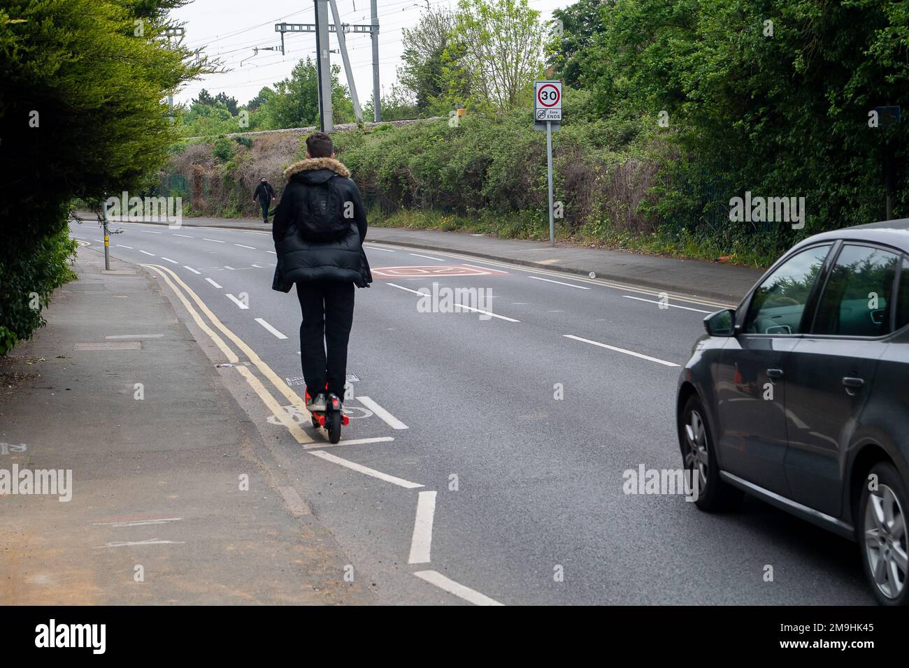 Slough, Berkshire, UK. 4th May, 2022. A young man rides a Neuron e