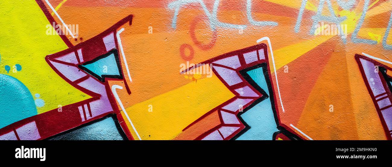 Close-up of colorful graffiti on wall Stock Photo