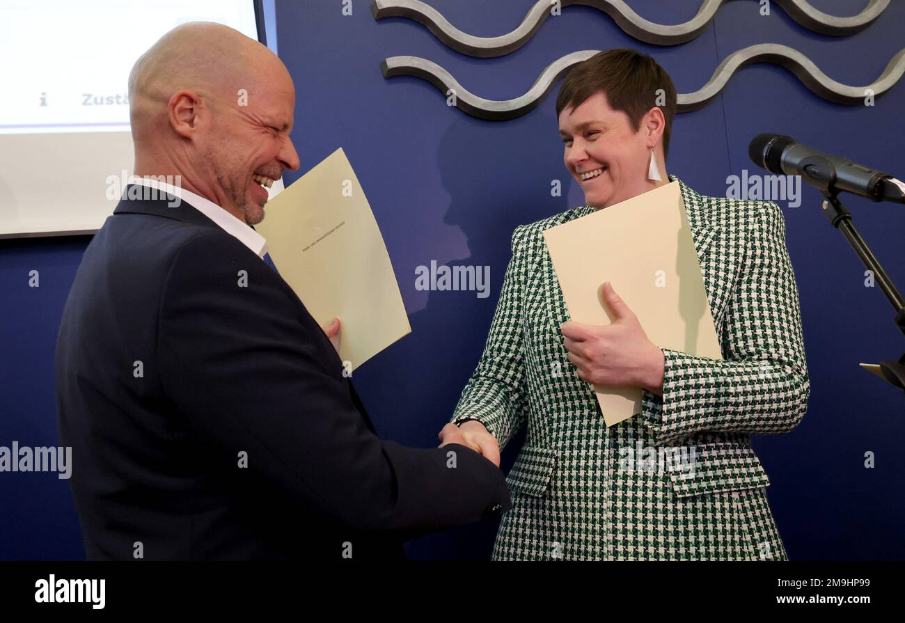 Rostock, Germany. 18th Jan, 2023. Eva Maria Kroeger (Die Linke, r) receives her certificate of appointment from Chris von Wrycz Rekowski (SPD, l), First Deputy Mayor and Senator for Finance, Digitalization and Order, after being sworn in as the new Lord Mayor of the Hanseatic City. Officially, the 40-year-old will take up her post on February 01, 2023. She is the first woman to be elected to the post. Credit: Bernd Wüstneck/dpa/Alamy Live News Stock Photo