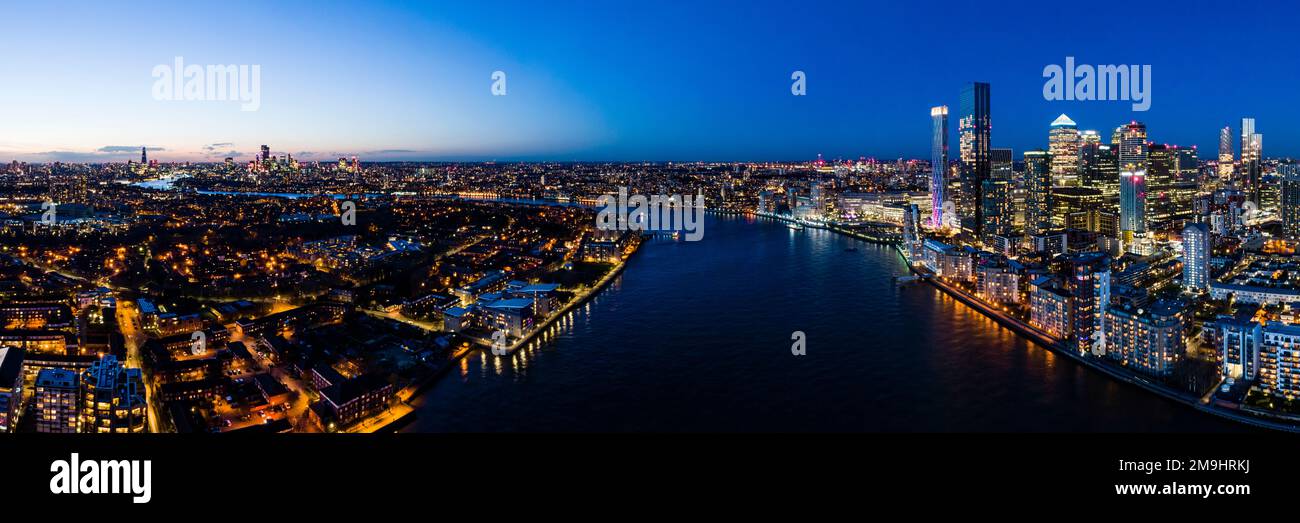 Aerial view of cityscape with skyscrapers and River Thames at night, London, England, UK Stock Photo