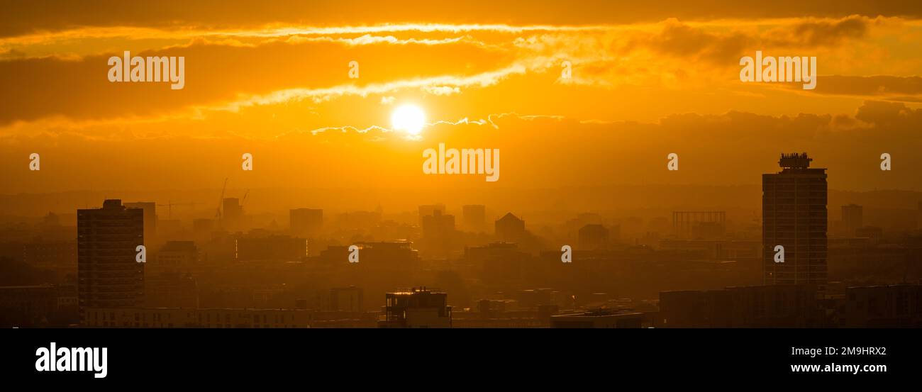 Aerial view of city with silhouettes of skyscrapers at sunset, London, England, UK Stock Photo