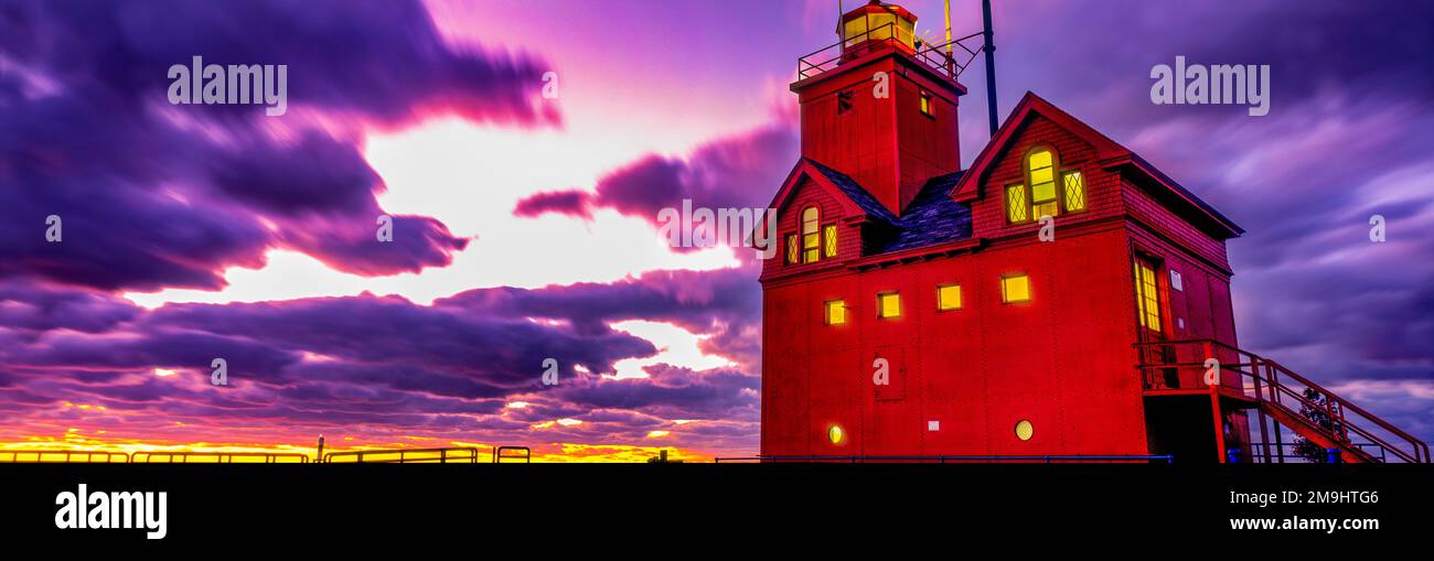 Low angle view of lighthouse at dusk, Big Red Light House, Holland, Michigan, USA Stock Photo