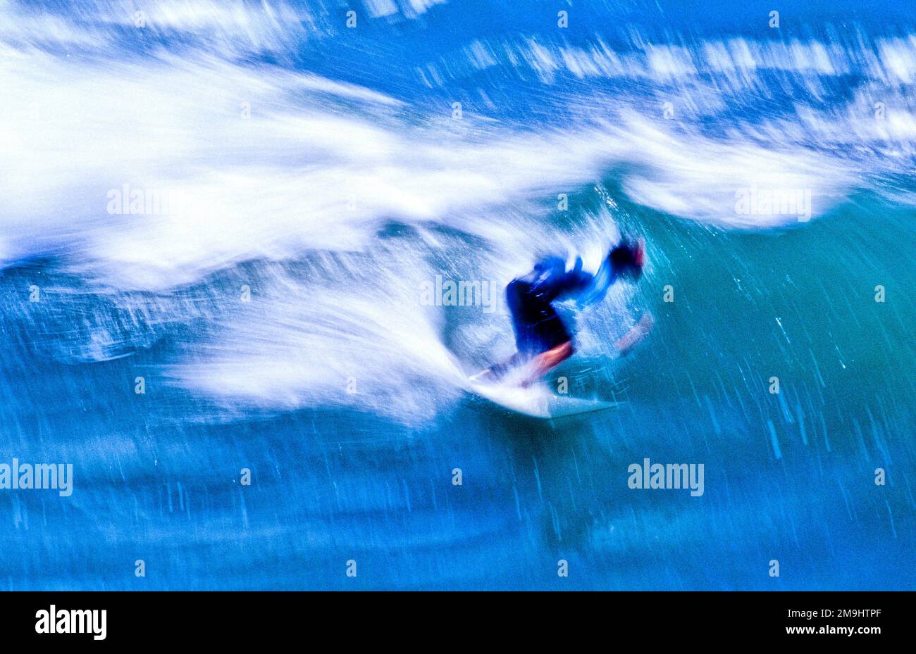 Surfer on surfboard on sea wave, California, USA Stock Photo