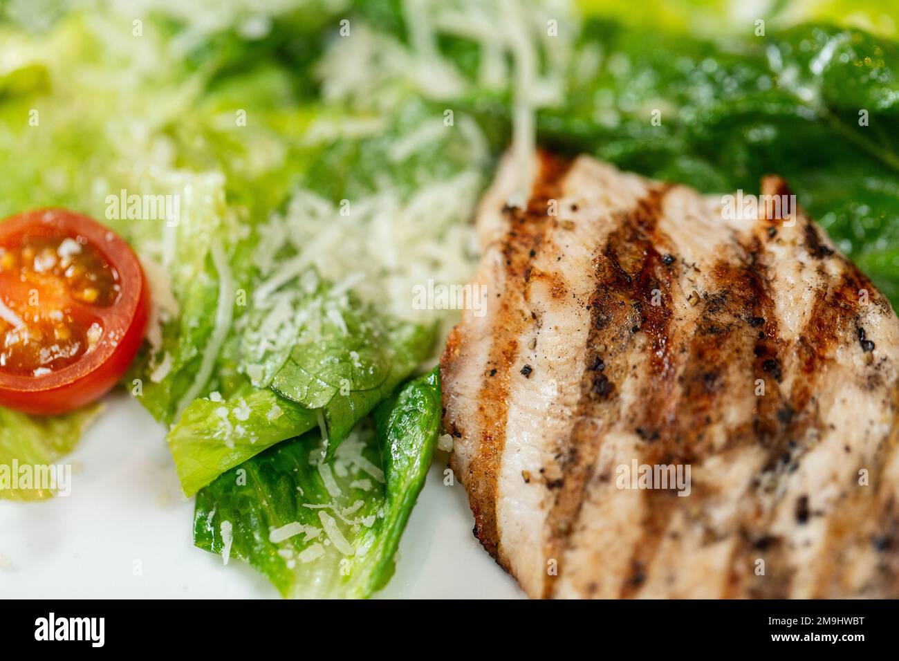 close up of chicken with vegetable salad on plate Stock Photo