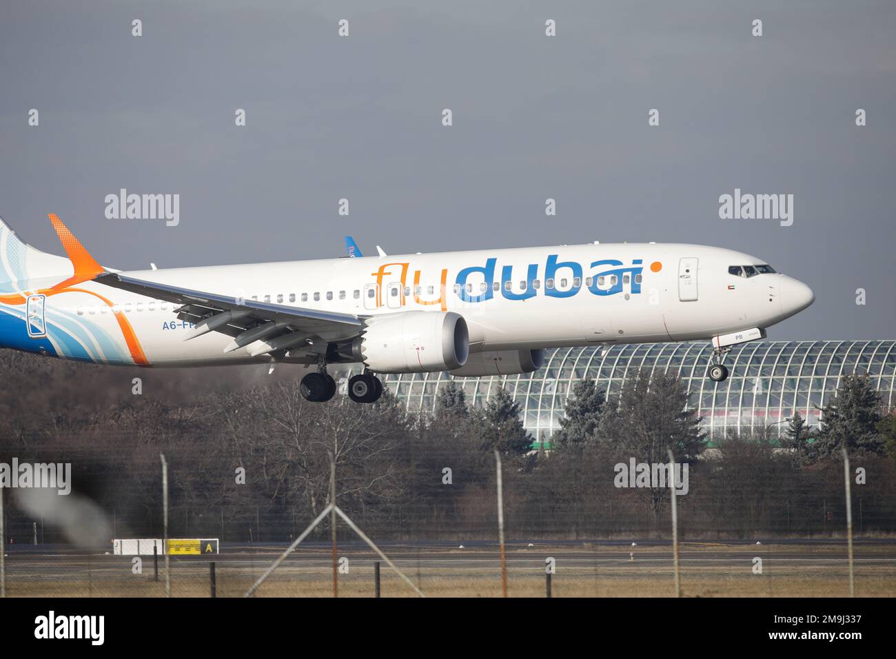 Otopeni, Romania - January 17, 2023: Fly Dubai airline plane landing at the Henri Coanda International Airport. Stock Photo