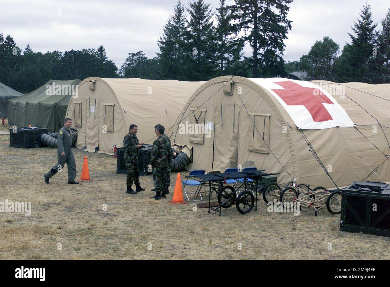 020717-F-5735S-001. [Complete] Scene Caption: US Air Force Reserve (USAFR) Medical personnel await the arrival of patients at the Expeditionary Medical System (EMEDS) Hospital during a medical exercise held at Fort Lewis, Washington (WA), during Exercise SEAHAWK 2002. Seahawk combines active duty and reserve components from the US Air Force (USAF), US Navy (USN), US Coast Guard (USCG), US Public Health Service, Royal Canadian Armed Forces (RCAF), Federal Bureau of Investigation (FBI), Federal Emergence Management Association (FEMA) and multiple civilian first responder agencies in coordinated Stock Photo