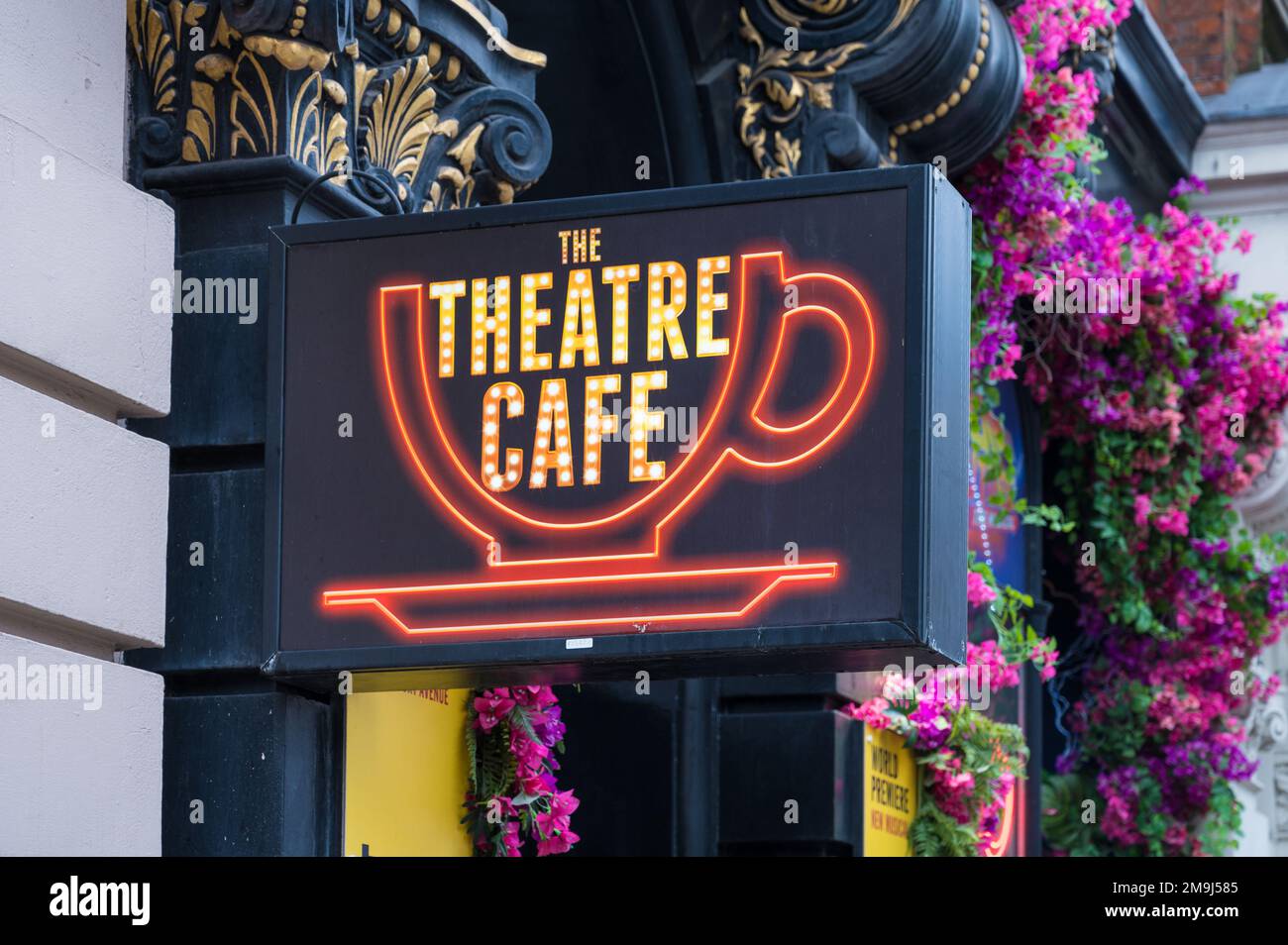 Colourful facade with neon sign of The Theatre Cafe, a theatre themed