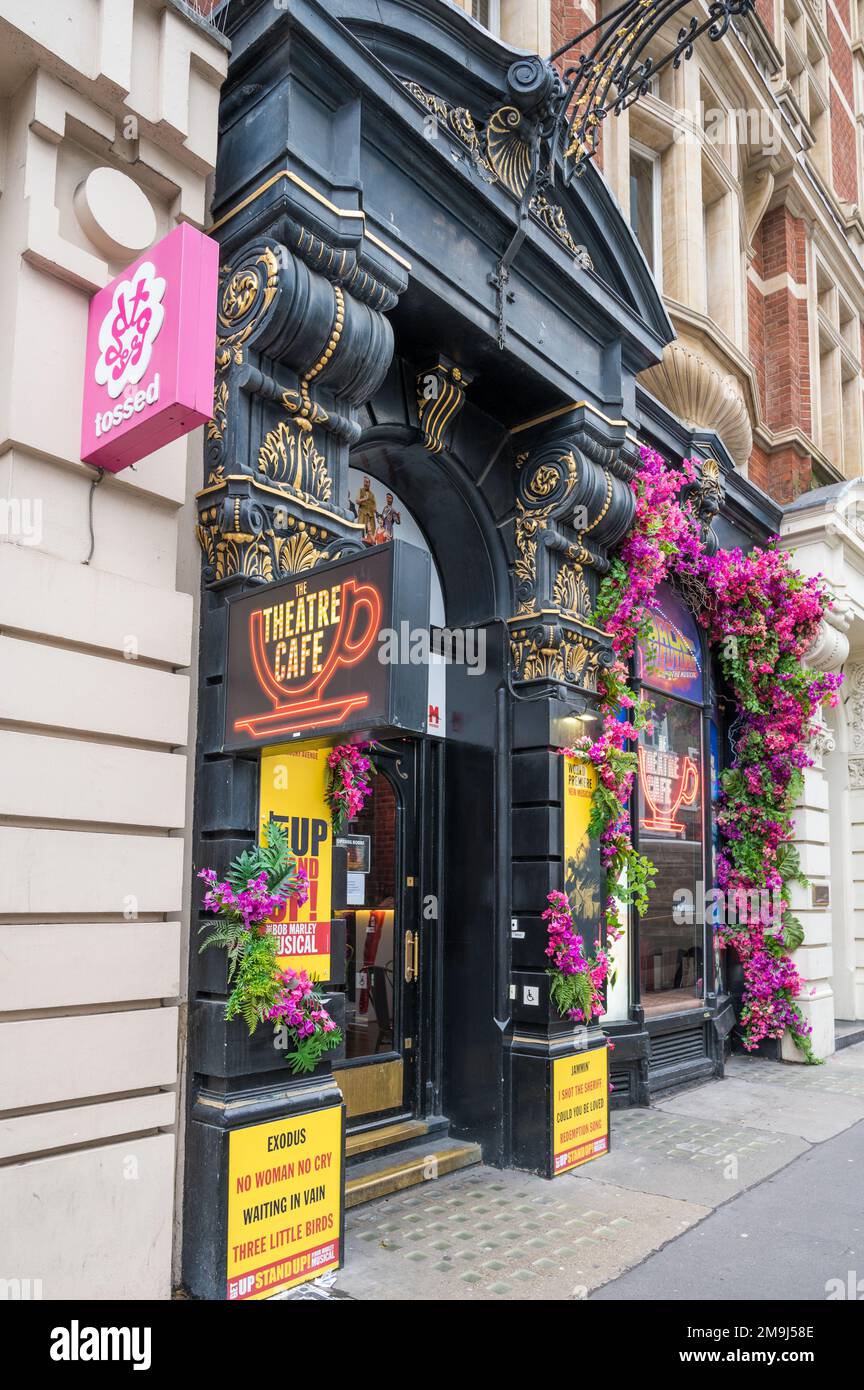 Colourful facade with neon sign of The Theatre Cafe, a theatre themed