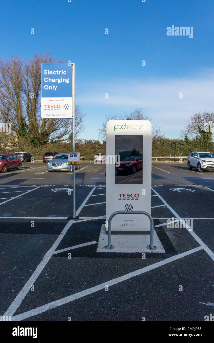 Pod Point EV charging point in a Tesco supermarket car park. Stock Photo