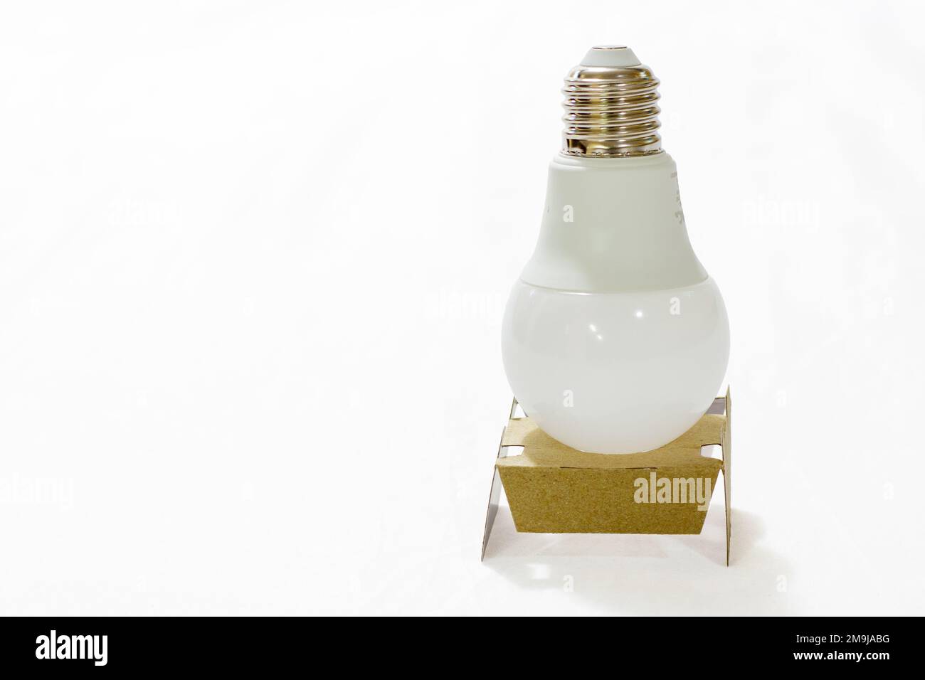 led light bulb in cardboard, on white background Stock Photo
