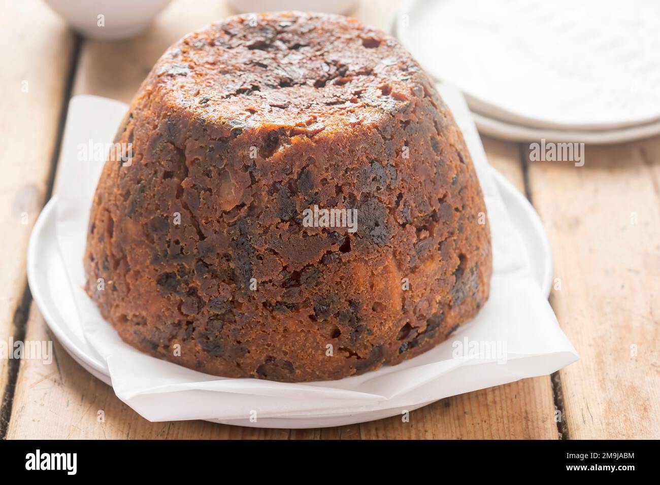 Christmas pudding. Irish boiled cake with cranberries, raisins and prunes. Stock Photo