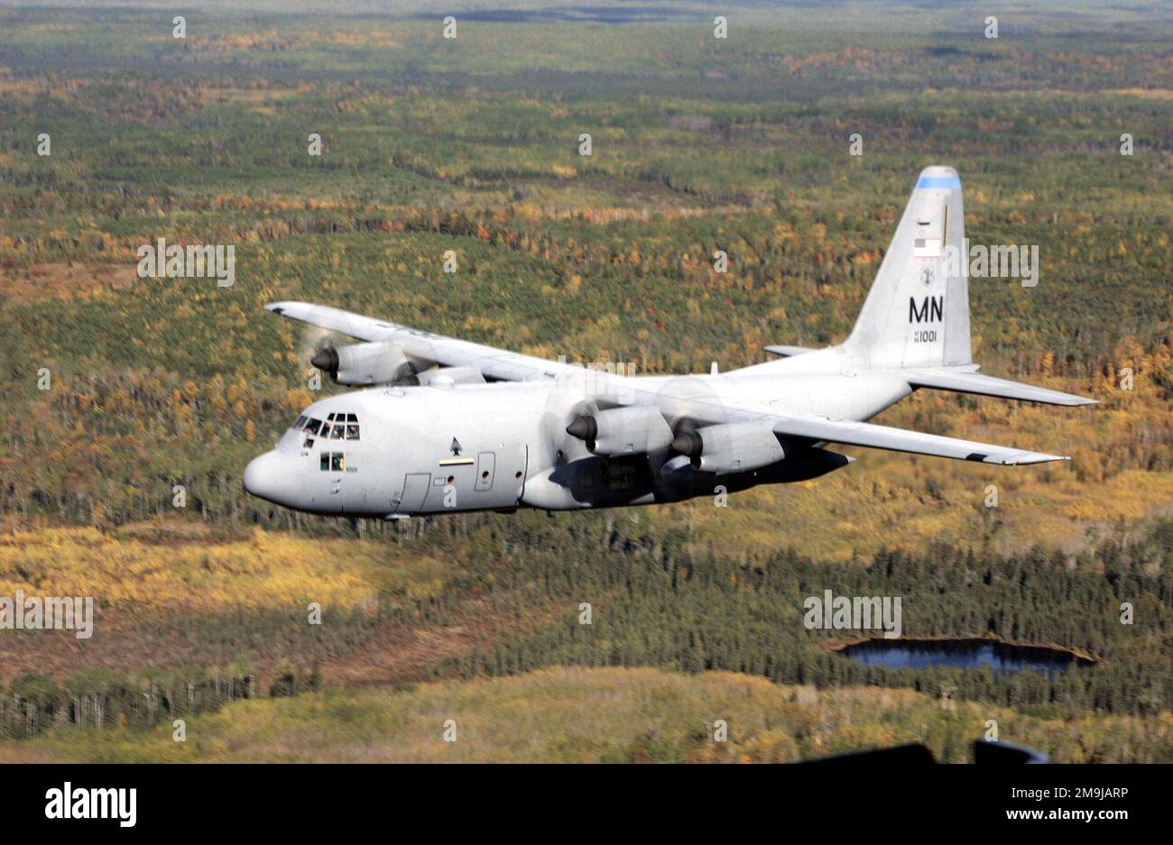 A US Air Force (USAF) Minnesota (MN) Air National Guard (ANG) C-130H3 Hercules aircraft assigned to the 133rd Airlift Wing (AW), flies over the Minnesota countryside near Lake Superior. Base: Duluth State: Minnesota (MN) Country: United States Of America (USA) Stock Photo