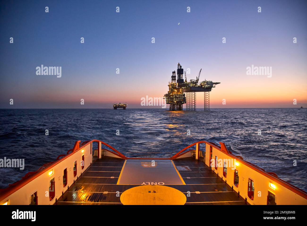 Anchor handing vessel  in the sea during cargo operations for offshore oil production platform. Stock Photo