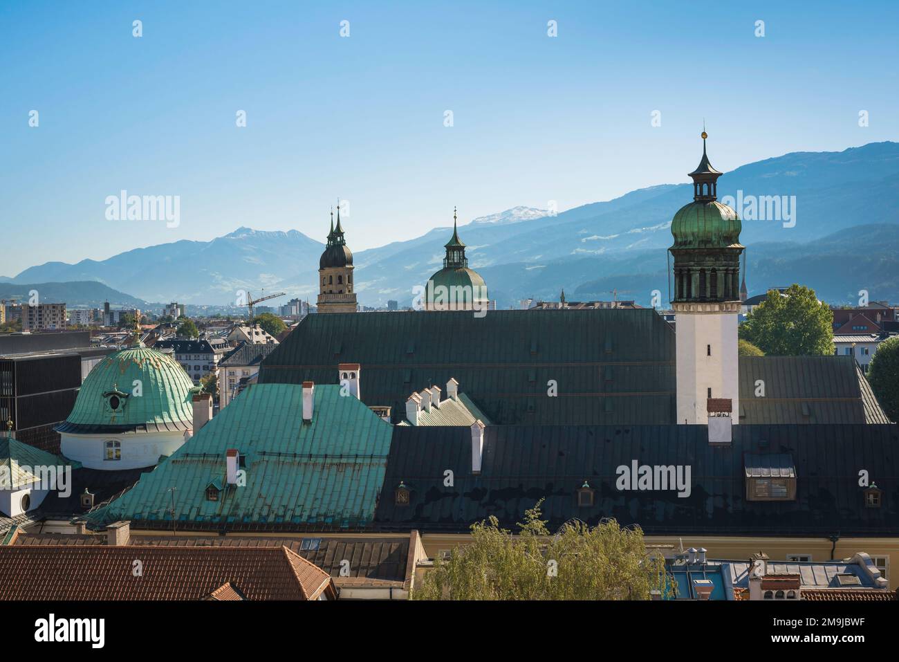 Innsbruck Hofburg, view of the roofline of the Hofkirche, the Baroque church of the Hofburg Palace, viewed against the Austrian alps, Innsbruck Stock Photo