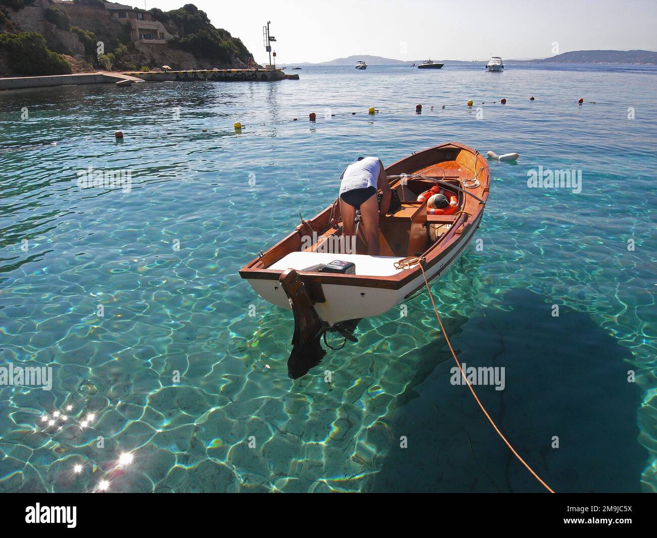 Fisherman and your boat in Tavolara Island, Sardinia, Italy Stock Photo