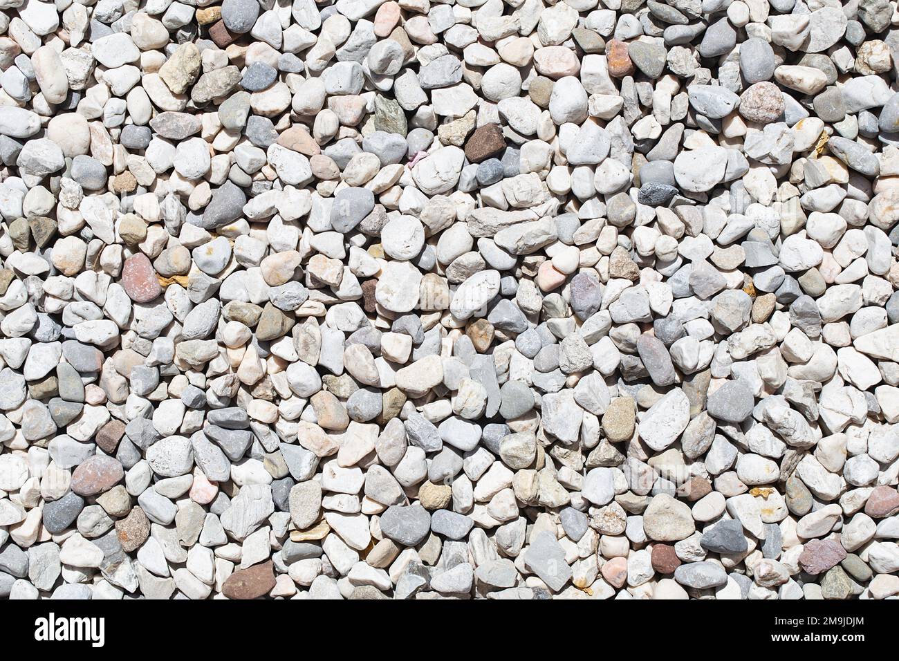 Small white stone gravel background texture. rocky, stony pebbles. Stock Photo