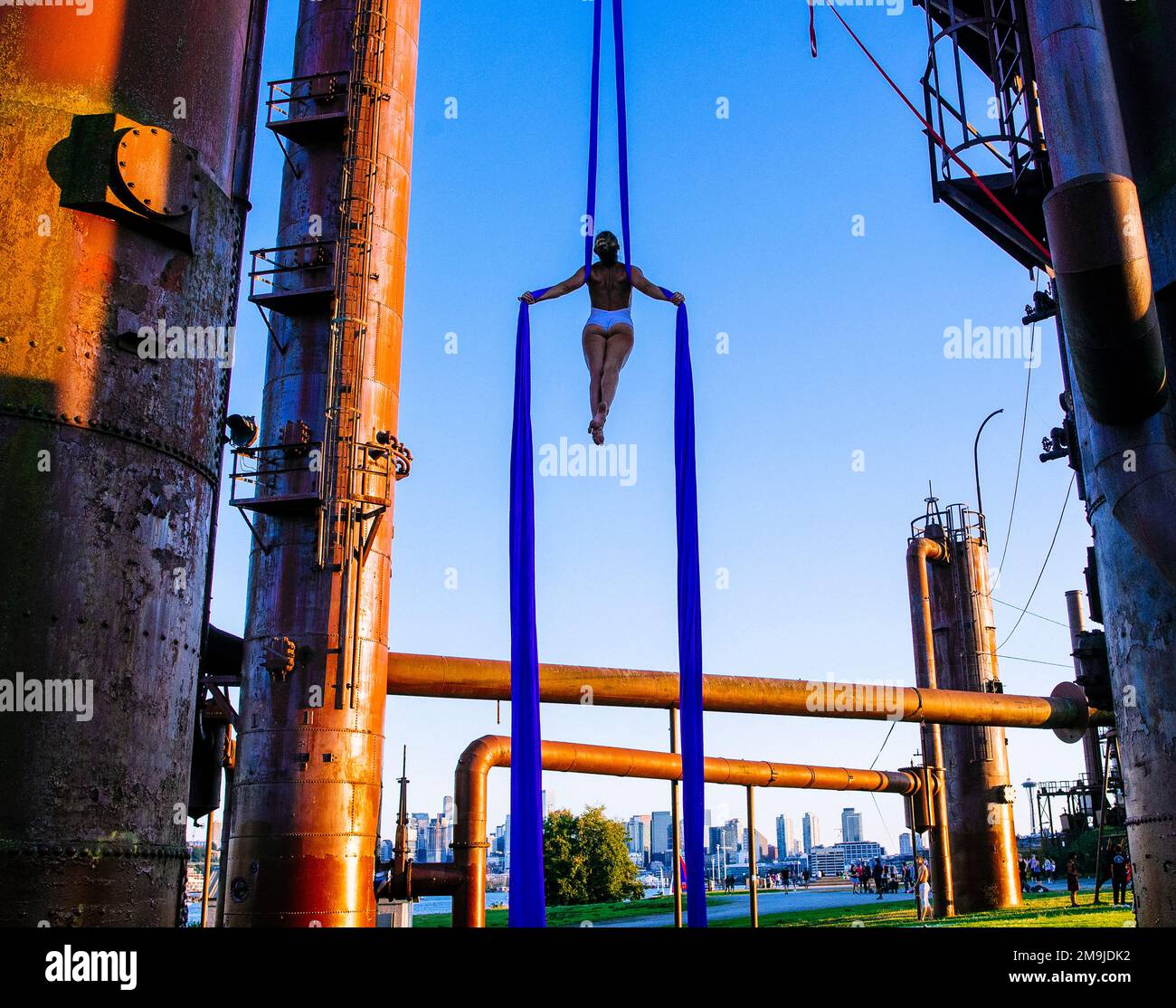 Acrobat on refinery pipes, Bainbridge Island, Washington, USA Stock Photo