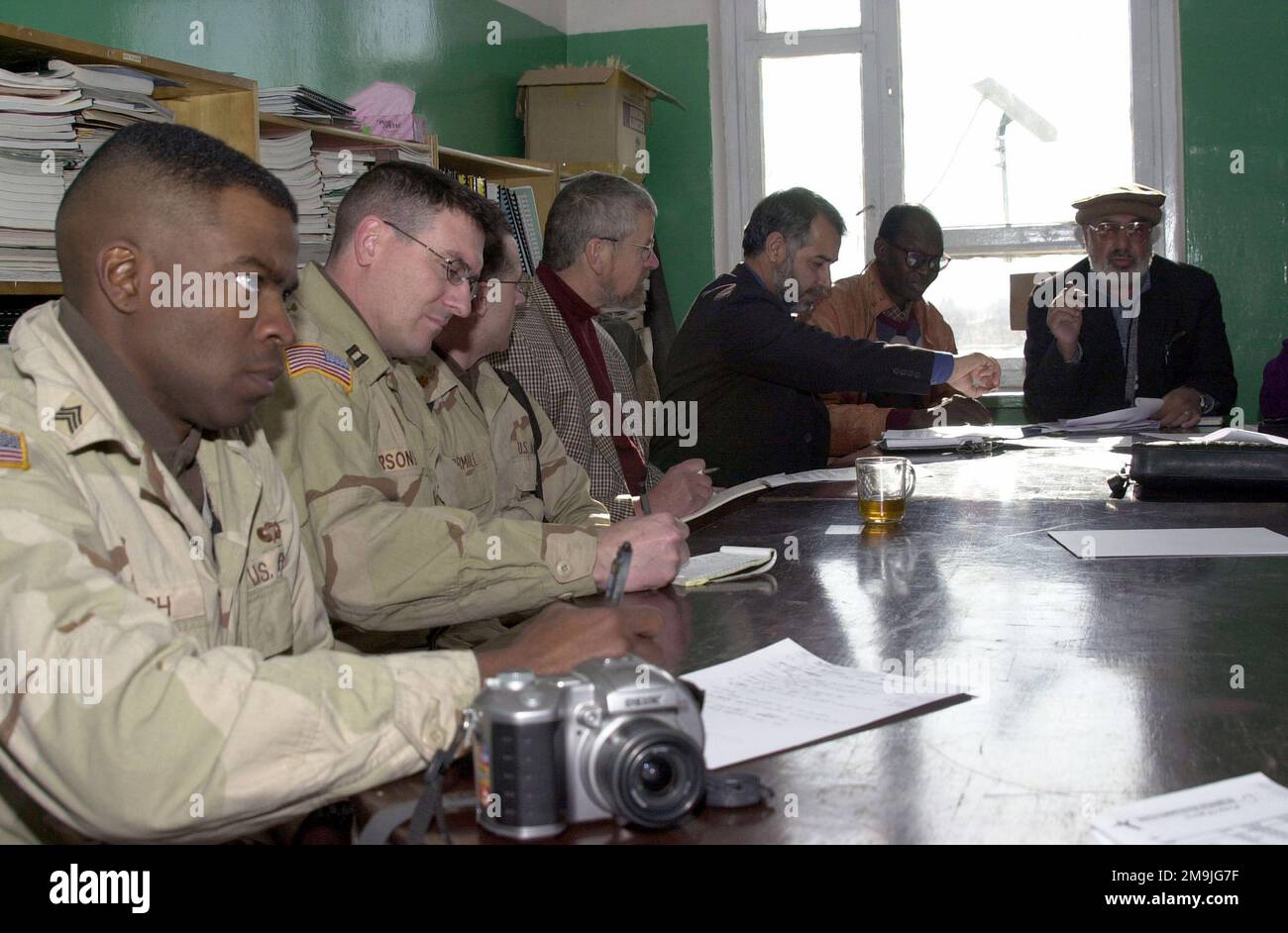US Army (USA) soldiers and local Afghans meet with the Minister of ...