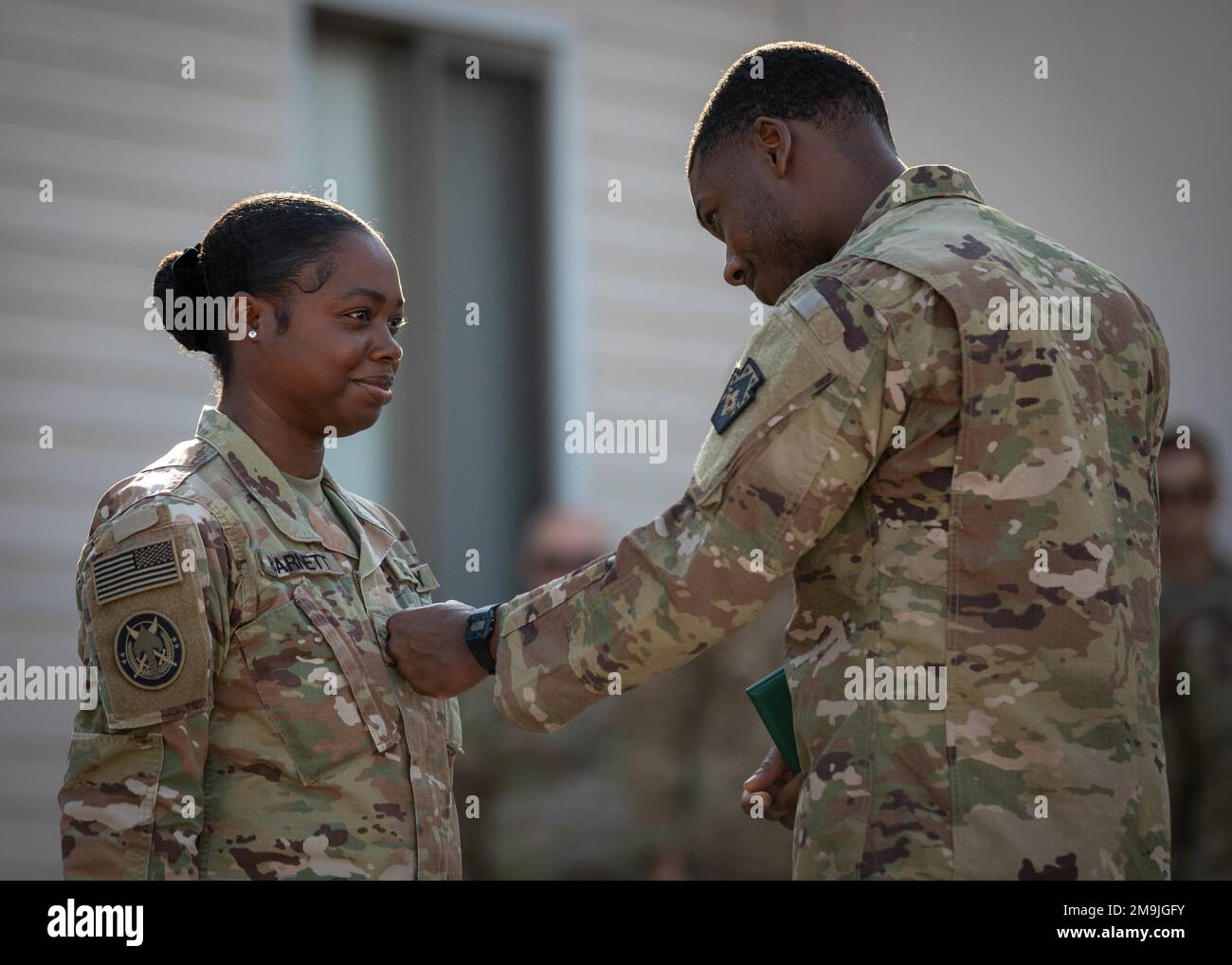 Army Staff Sgt. Karahn Bellamy pins the rank of sergeant on newly promoted Sgt. Kerry-Ann Barnett on May 19, 2022. Prior to her promotion, Staff Sgt. Bellamy recognized Barnett’s hard work and dedicated service to the Army, as well as her dedication to the Special Operations Joint Task Force – Levant mission. Stock Photo