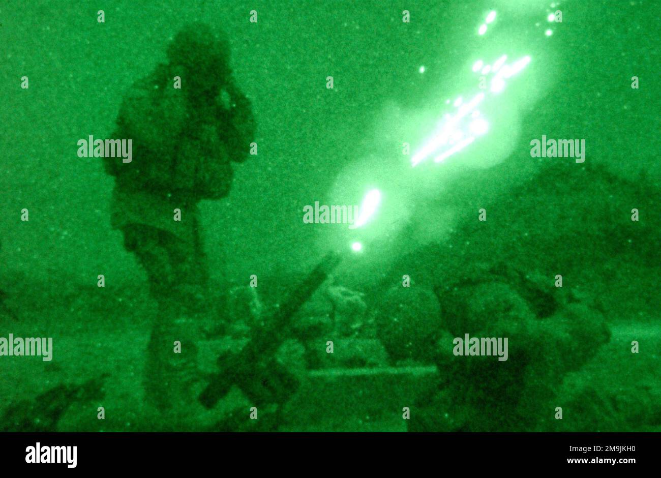 US Army (USA) Soldiers assigned to Alpha Company, 82nd Airborne Division, fire an M83A3 illumination round from their 60mm M224 lightweight company mortar, in order to get a better look at the outer perimeter of Bagram Air Base (AB), Afghanistan, during Operation ENDURING FREEDOM. Subject Operation/Series: ENDURING FREEDOM Base: Bagram Air Base State: Parwan Country: Afghanistan (AFG) Stock Photo