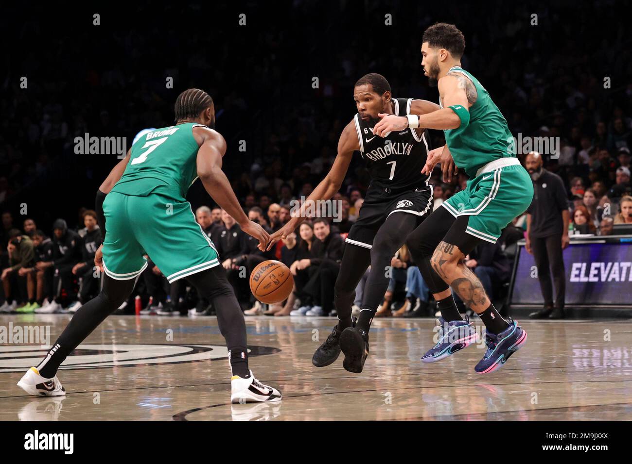 Defend Nba Brooklyn Nets forward Kevin Durant (7) dribbles the ball as Boston ...