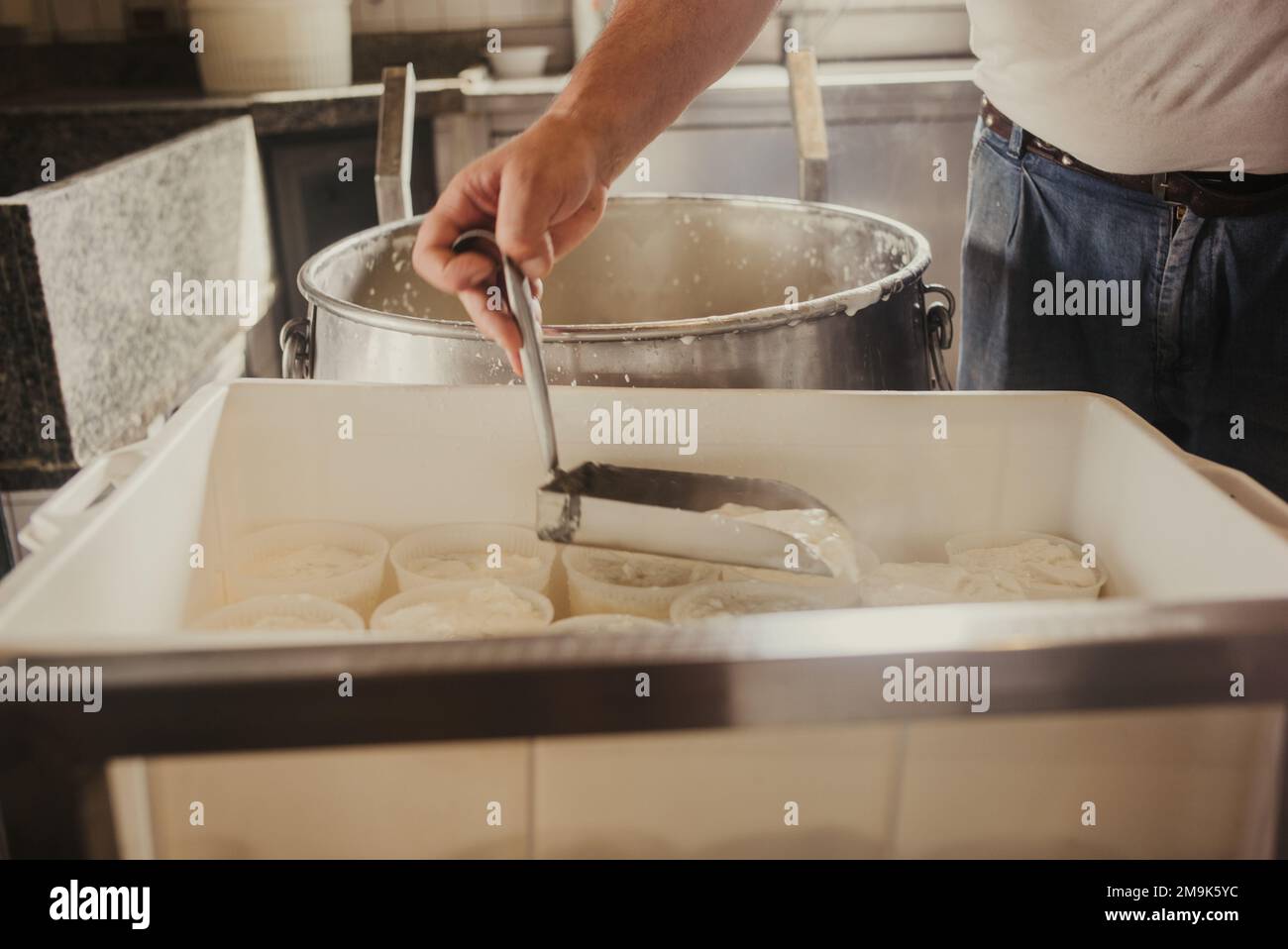 Making of ricotta cheese in a traditional way in Sicily Stock Photo Alamy