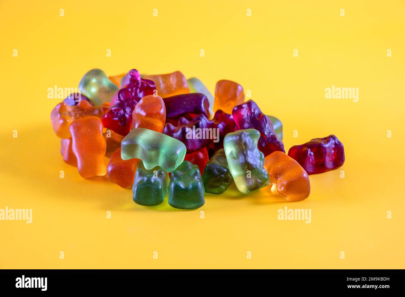 chewy kids candy gums isolated on a yellow background Stock Photo