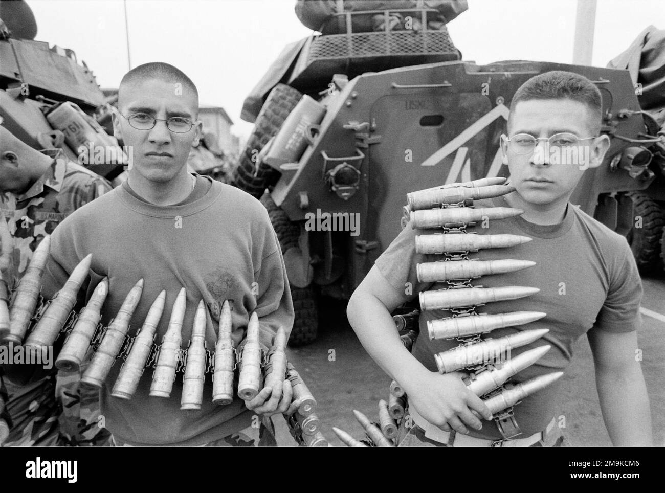 Two US Marine Corps Reserve (USMCR) Marines assigned to A/Company, 4th Light Armored Reconnaissance Battalion (LAR), hold the ammunition for the 25mm M242 Chain Gun weapon, from their Light Armored Vehicles (LAV-25), at Camp Pendleton, California (CA), in preparation for mobilization in support of Operation ENDURING FREEDOM. Base: Marine Corps Base Camp Pendleton State: California (CA) Country: United States Of America (USA) Stock Photo