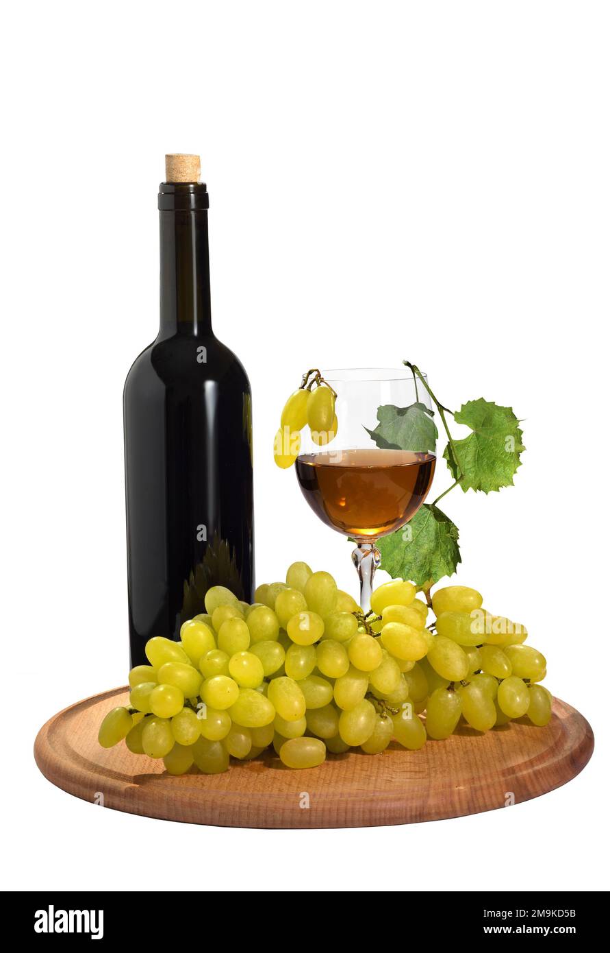 Ripe grapes with a glass of grape juice and a bottle on the isolated
